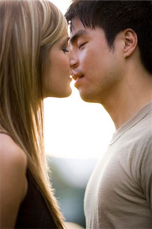 romantic boy and girl - Young couple about to kiss Stock Photo - Premium Royalty-Free, Code: 640-03259852