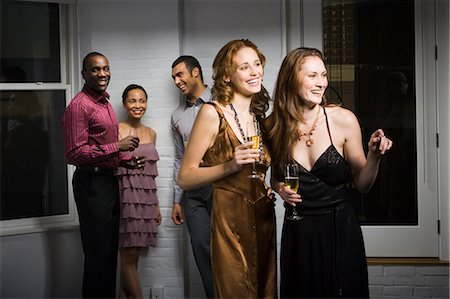 people gossiping - Partygoers socializing Stock Photo - Premium Royalty-Free, Code: 640-03264001