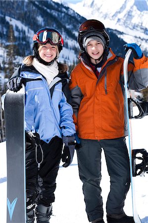 simsearch:640-03263432,k - A brother and sister with snowboards outside Stock Photo - Premium Royalty-Free, Code: 640-03264194