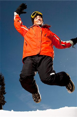 simsearch:640-03264331,k - Woman jumping outside in the snow Stock Photo - Premium Royalty-Free, Code: 640-03264298