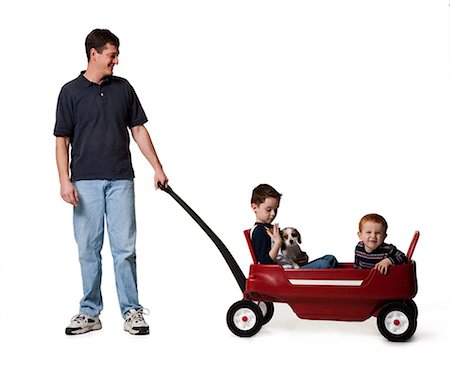 silhouette group people - Father with sons and toy wagon Stock Photo - Premium Royalty-Free, Code: 640-03264430