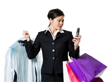 simsearch:640-03260747,k - Woman with shopping bags and cellphone Stock Photo - Premium Royalty-Free, Code: 640-03264700