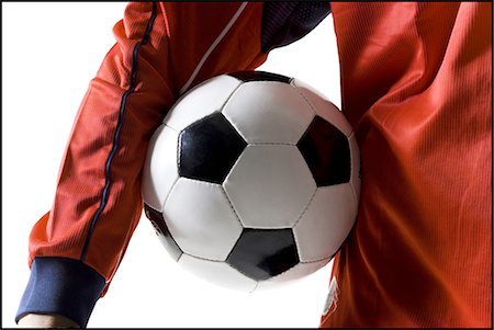 simsearch:640-03256208,k - Joueur de football avec ballon Photographie de stock - Premium Libres de Droits, Code: 640-03264986