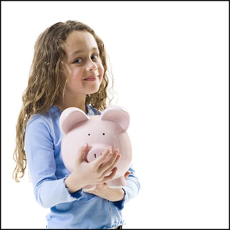 Young girl hugging piggy bank Stock Photo - Premium Royalty-Free, Code: 640-03265240