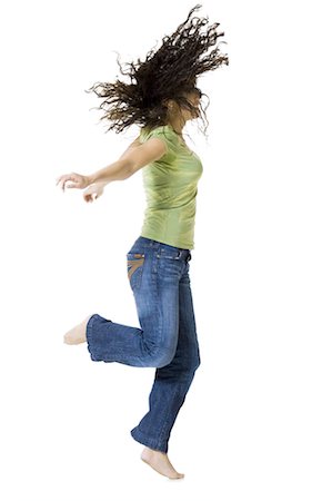 simsearch:640-03265333,k - Woman dancing and shaking her hair Stock Photo - Premium Royalty-Free, Code: 640-03265328