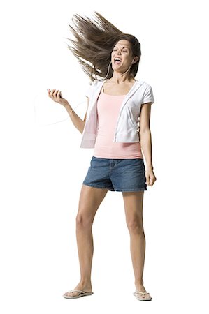 simsearch:640-03265333,k - Woman listening to MP3 player and dancing Stock Photo - Premium Royalty-Free, Code: 640-03265332