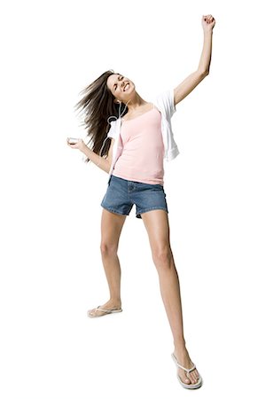 simsearch:640-03265333,k - Woman listening to MP3 player and dancing Stock Photo - Premium Royalty-Free, Code: 640-03265333