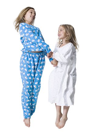 preteen pyjama - Young sisters in pajamas Stock Photo - Premium Royalty-Free, Code: 640-03265363