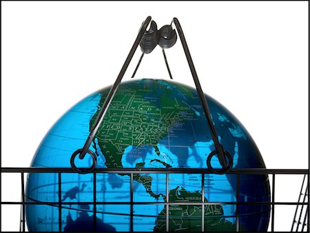 Close-up of a globe in a shopping basket Stock Photo - Premium Royalty-Free, Code: 640-03265407