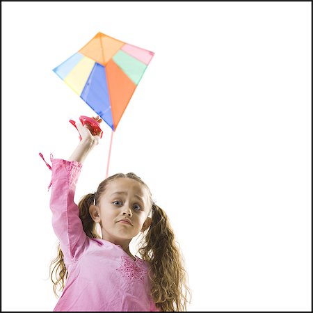 people flying a kite - Young girl flying a kite Stock Photo - Premium Royalty-Free, Code: 640-03265442