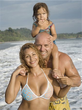 Portrait of a man and a  woman with their daughter on the beach Stock Photo - Premium Royalty-Free, Code: 640-03265651