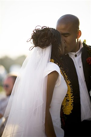 Close-up of a bride and groom kissing Stock Photo - Premium Royalty-Free, Code: 640-03265699