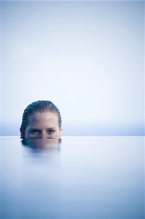 Portrait of a young woman in water Stock Photo - Premium Royalty-Free, Code: 640-03265714