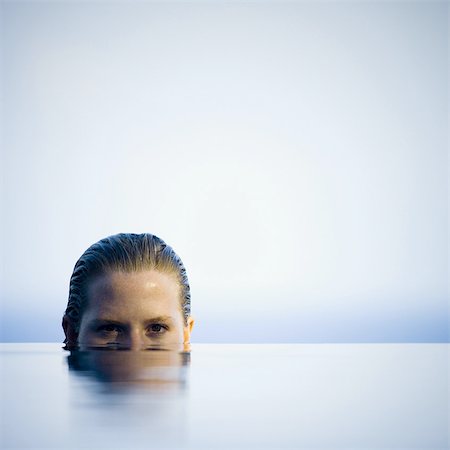 Portrait of a young woman in water Stock Photo - Premium Royalty-Free, Code: 640-03265713