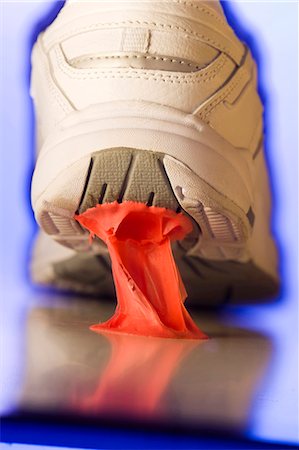 stuck - Close up of gum stuck to running shoe Stock Photo - Premium Royalty-Free, Code: 640-03260667