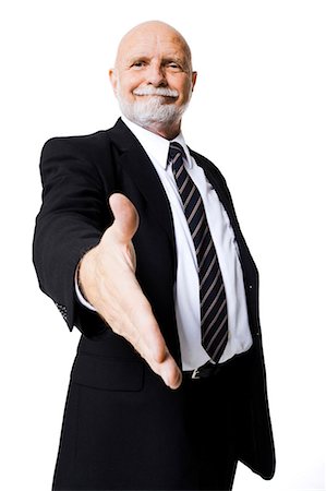 Portrait of businessman with outstretched hand Stock Photo - Premium Royalty-Free, Code: 640-03261080