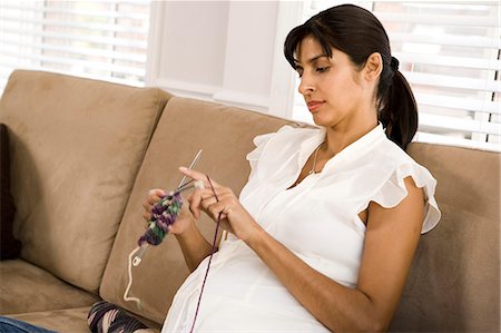 Pregnant woman knitting Stock Photo - Premium Royalty-Free, Code: 640-03261320