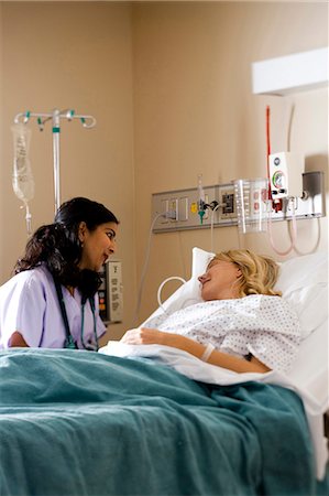 Woman in hospital bed Stock Photo - Premium Royalty-Free, Code: 640-03261379