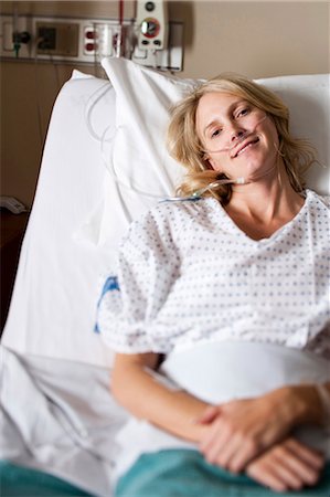 Woman in hospital bed Stock Photo - Premium Royalty-Free, Code: 640-03261384