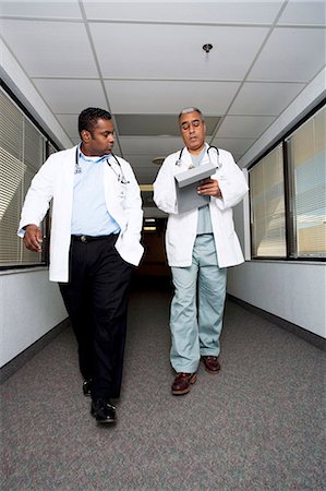 Male doctors walking and talking Stock Photo - Premium Royalty-Free, Code: 640-03261686