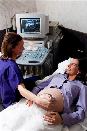 Pregnant woman having an ultrasound Stock Photo - Premium Royalty-Free, Code: 640-03261728