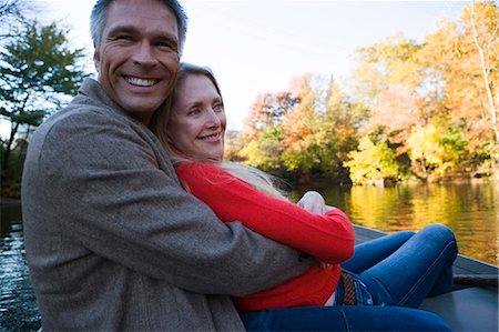 Couple sitting by water Stock Photo - Premium Royalty-Free, Code: 640-03261948