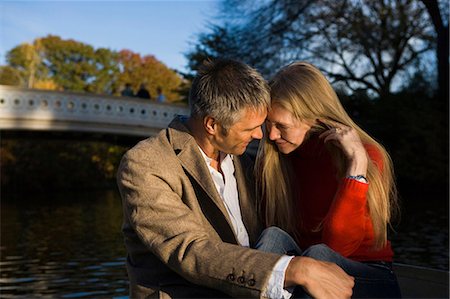 Couple sitting by water Stock Photo - Premium Royalty-Free, Code: 640-03261951