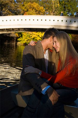 Couple sitting by water Stock Photo - Premium Royalty-Free, Code: 640-03261952