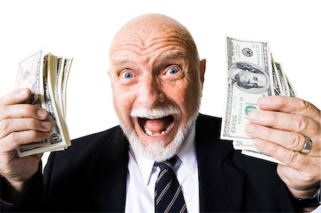 Excited mature man with large sum of money Stock Photo - Premium Royalty-Free, Code: 640-03262034