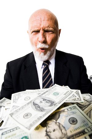 Excited mature man with large sum of money Stock Photo - Premium Royalty-Free, Code: 640-03262036