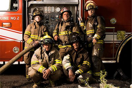 fire truck - Group portrait of firefighters and fire engine Stock Photo - Premium Royalty-Free, Code: 640-03262178