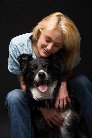 Portrait of a woman with black dog Stock Photo - Premium Royalty-Free, Code: 640-03262466