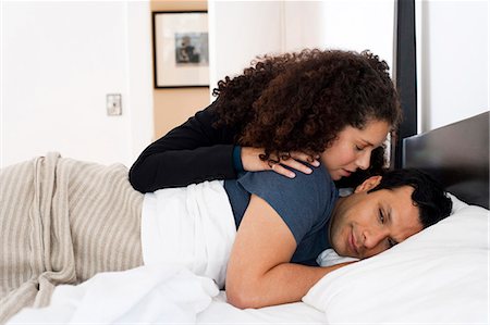 Woman watching man sleeping in bed Stock Photo - Premium Royalty-Free, Code: 640-03262621