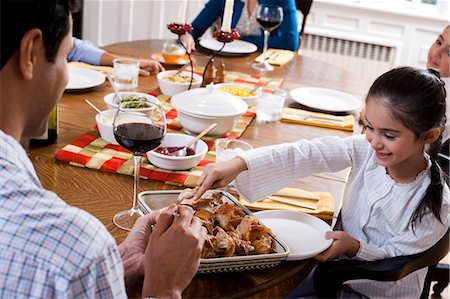 Family sitting at dinner table Stock Photo - Premium Royalty-Free, Code: 640-03262689