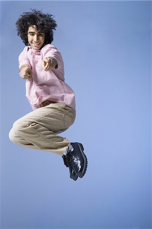 Boy jumping Stock Photo - Premium Royalty-Free, Code: 640-03263407