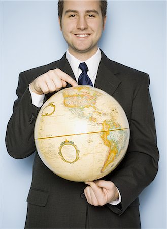 rotation - Man holding globe Stock Photo - Premium Royalty-Free, Code: 640-03281693