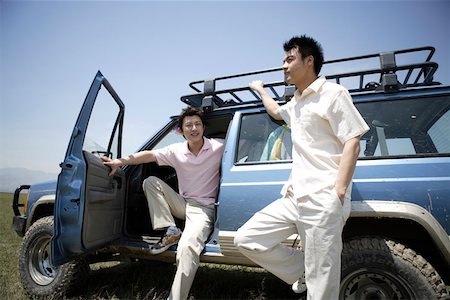 Two young men and jeep Stock Photo - Premium Royalty-Free, Code: 642-01735492