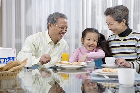 simsearch:642-02005954,k - a girl and her grandma and grandpa taking breakfast Stock Photo - Premium Royalty-Free, Code: 642-02005947