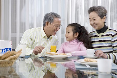 simsearch:642-02005954,k - a girl and her grandma and grandpa taking breakfast Stock Photo - Premium Royalty-Free, Code: 642-02005948