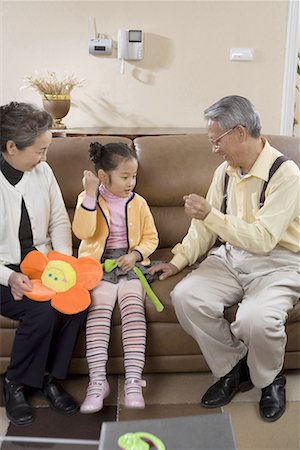 simsearch:642-02005954,k - an old couple and their granddaughter,playing a finger- guessing game Stock Photo - Premium Royalty-Free, Code: 642-02005955