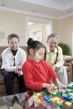simsearch:642-02005954,k - an old couple playing with their granddaughter Stock Photo - Premium Royalty-Free, Code: 642-02005958
