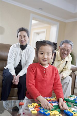 simsearch:642-02005954,k - an old couple playing with their granddaughter Stock Photo - Premium Royalty-Free, Code: 642-02005959