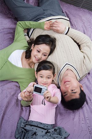 simsearch:642-02005954,k - a family lying on the bed Stock Photo - Premium Royalty-Free, Code: 642-02006134