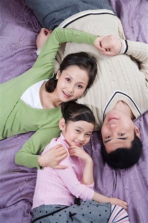 simsearch:642-02005954,k - a family lying on the bed Stock Photo - Premium Royalty-Free, Code: 642-02006133