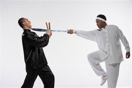 two men practicing Chinese Kungfu Stock Photo - Premium Royalty-Free, Code: 642-02006374