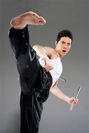 a man practicing nunchakus Stock Photo - Premium Royalty-Free, Code: 642-02006444