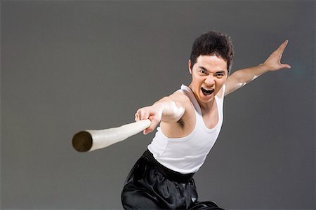 a man practicing a Chinese stick Foto de stock - Sin royalties Premium, Código: 642-02006451