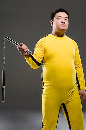 a man practicing nunchakus Stock Photo - Premium Royalty-Free, Code: 642-02006452