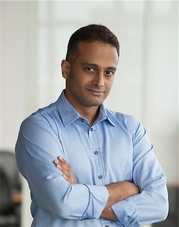 east indian (male) - Singapore, Businessman standing with folded arms Stock Photo - Premium Royalty-Free, Code: 655-08356882