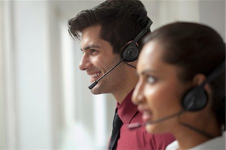 simsearch:6109-06002816,k - India, Two tele sales people with headphones Stock Photo - Premium Royalty-Free, Code: 655-08357170